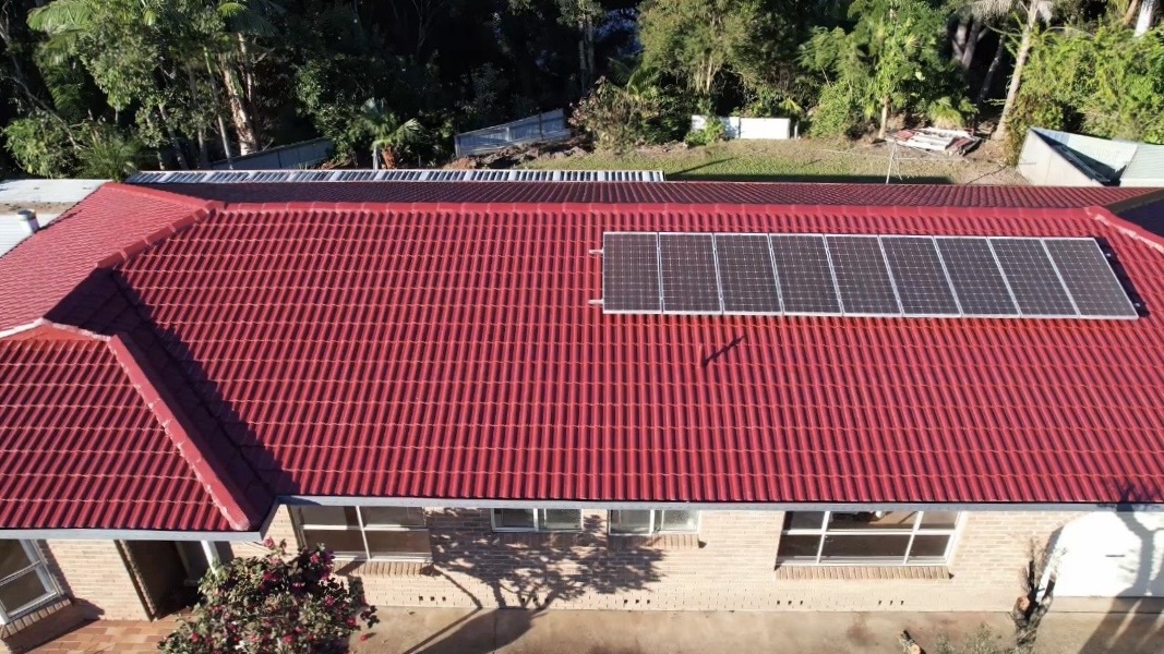 Aerial view of restored red tile roof after Dulux AcraTex coating